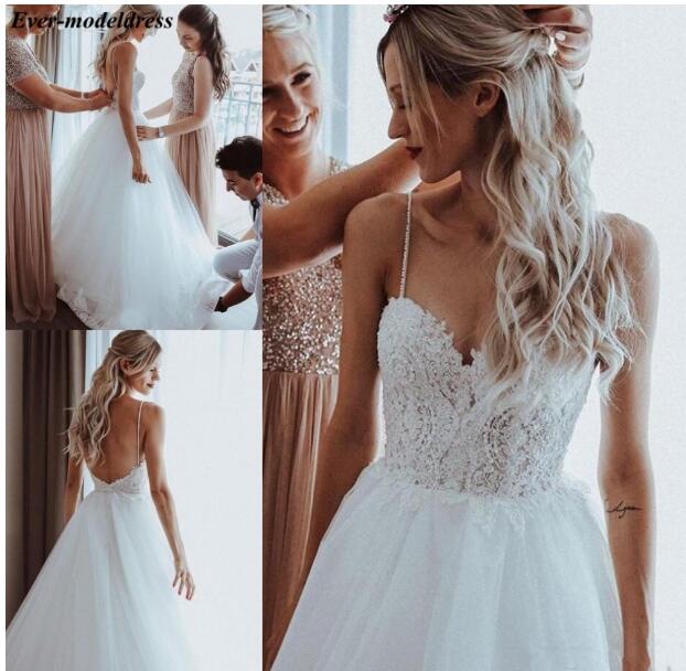 Beach Wedding Dresses 2020 Backless Lace Appliques Pearls ,Spaghetti S Siaoryne Beach Wedding Dresses 2020 Backless Lace Appliques Pearls ,Spaghetti S Siaoryne